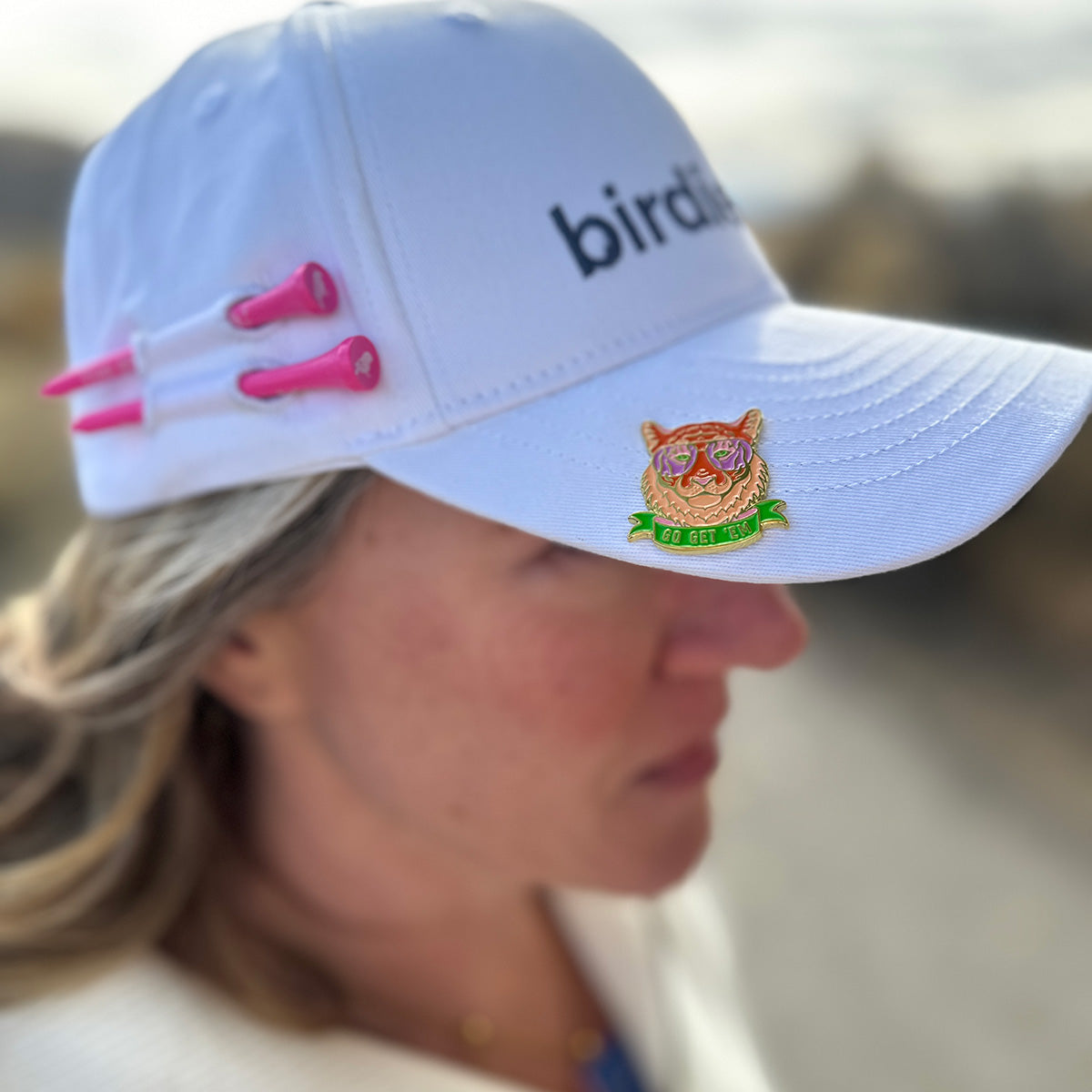 Woman Golfer wearing Birdie Girl Golf Hat with Go Get 'em Tiger ball marker hat clip