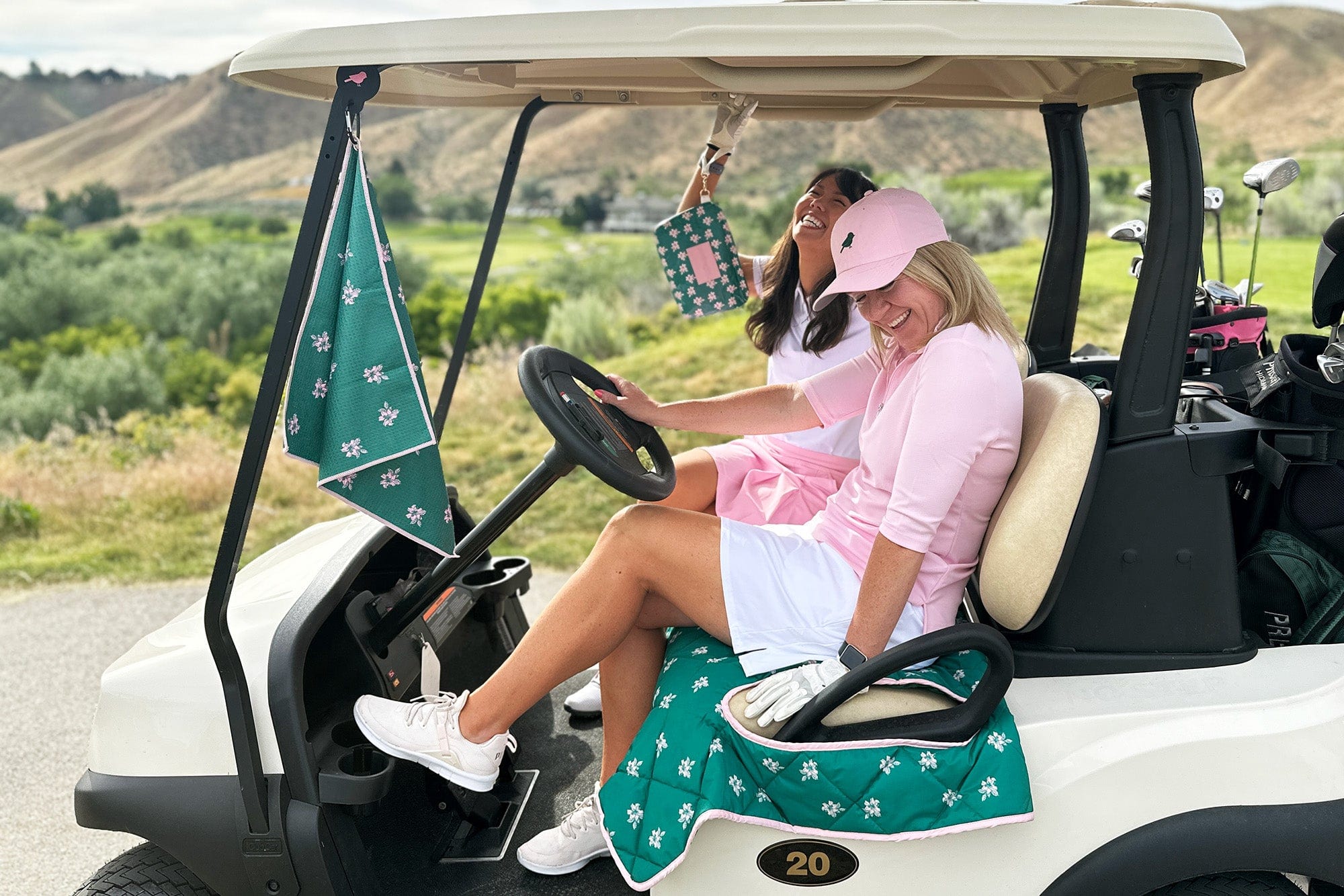 Happy women golfers in golf cart with birdie girl golf seat cover and golf accessories