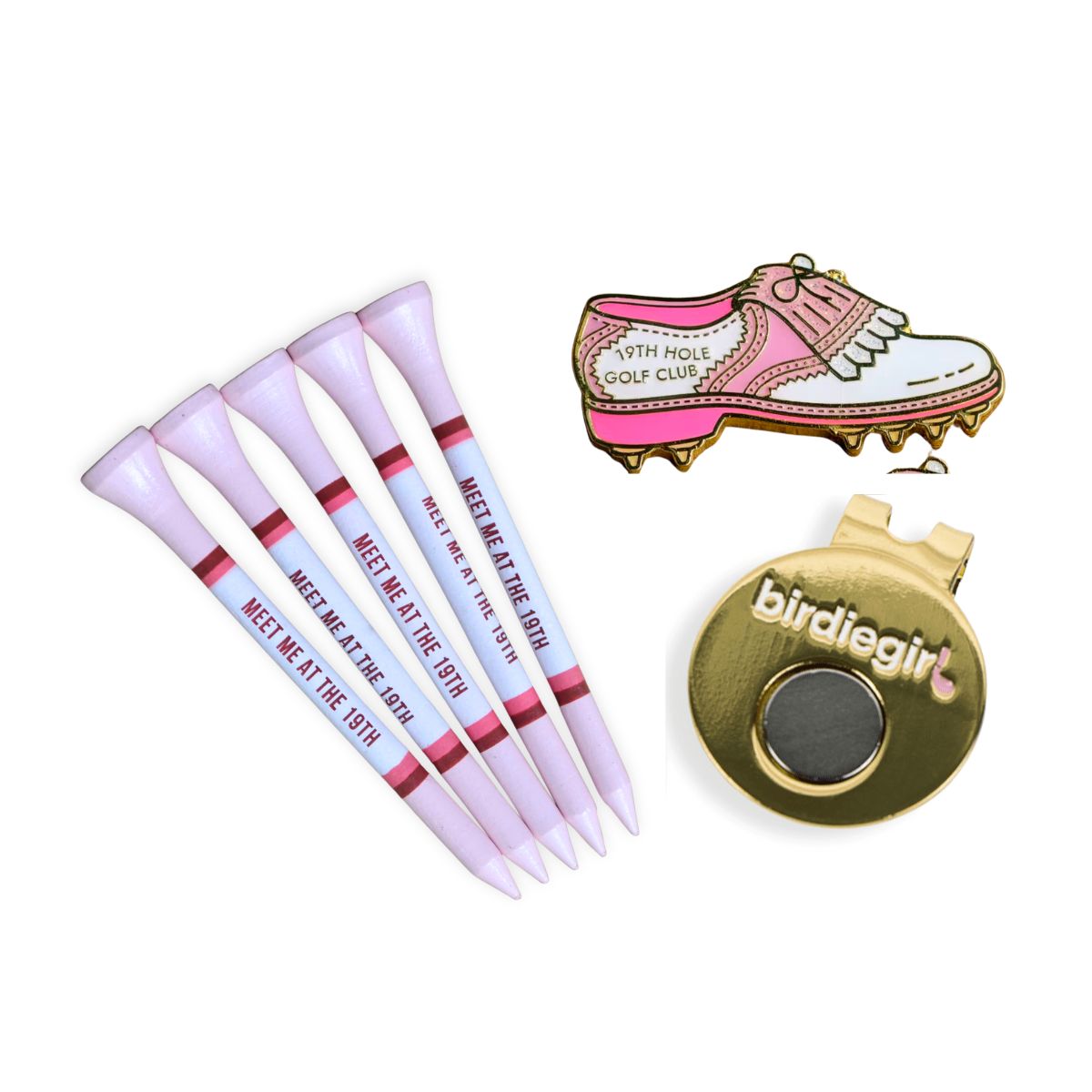 A golf-themed accessory set on a white background, including five light pink tees printed with 'MEET ME AT THE 19TH', a pink and white golf shoe enamel pin, and a gold birdie ball marker with 'birdiegirl' branding.