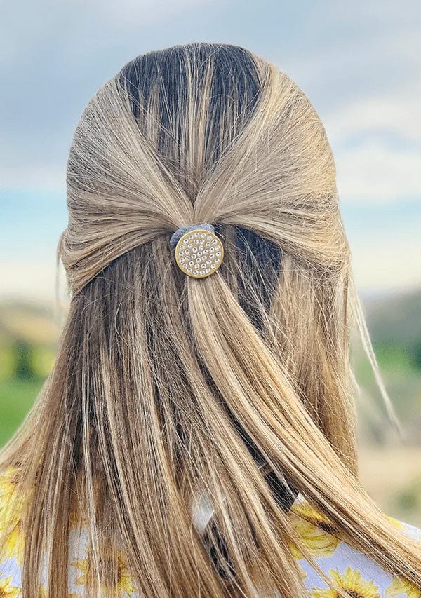 Woman Golfer with Magnetic Hair Tie Golf Ball Marker