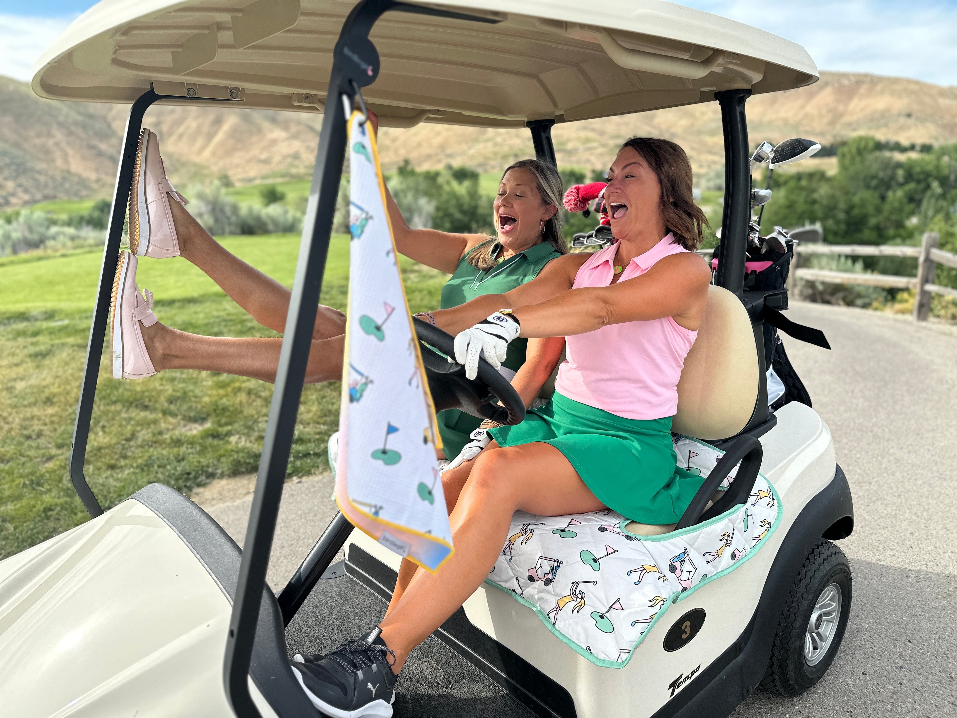 Two Women Golfers in golf cart with Birdie Girl Golf cart cover and accessories